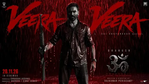 Dhanush holding a rifle in red rain under the words Veera Veera on the OM: Chapter 1 poster dated 20.11.26